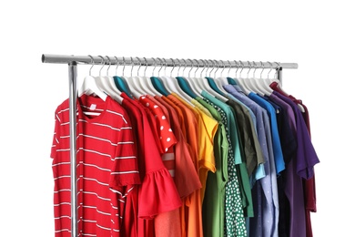 Wardrobe rack with different colorful clothes on white background