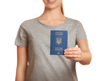 Photo of Woman holding Ukrainian travel passport against blurred background, closeup with space for text. International relationships