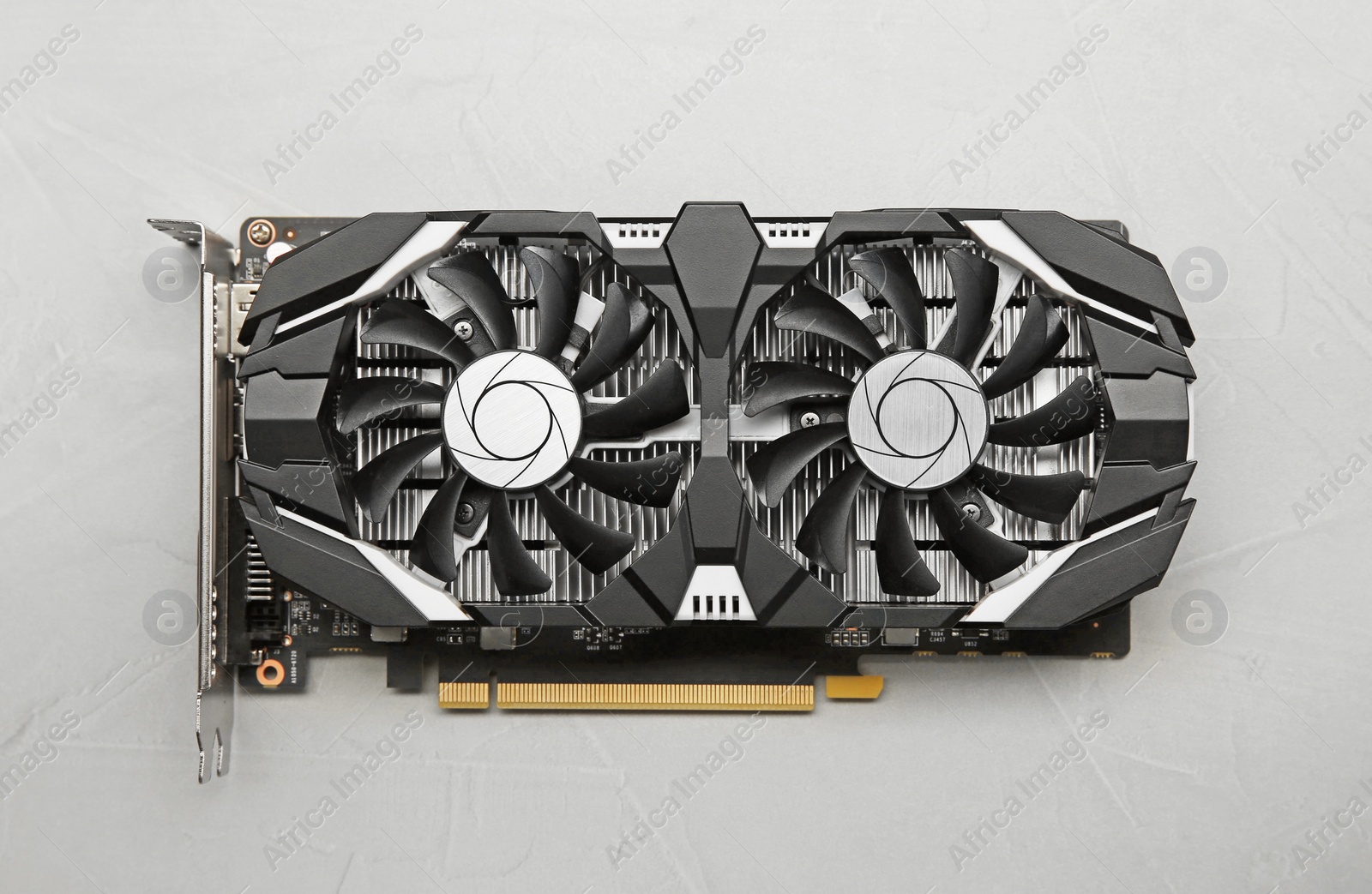 Photo of Computer graphics card on gray textured background, top view
