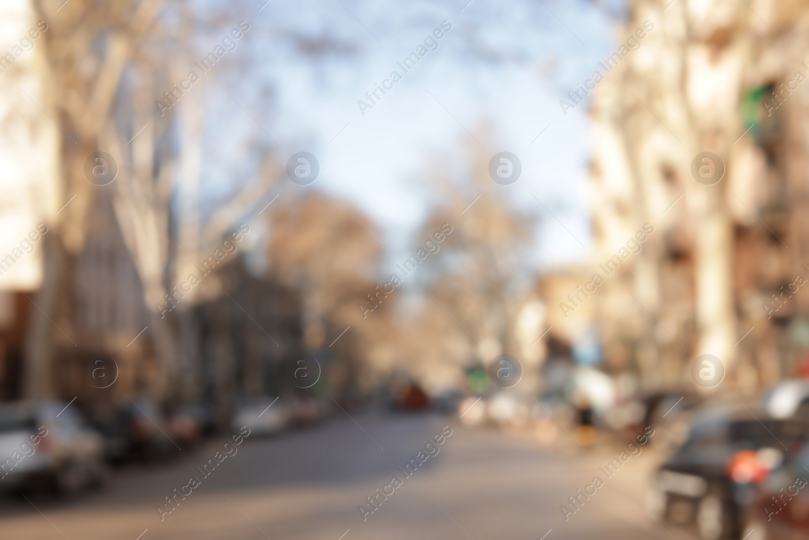 Photo of Blurred view of city street on sunny day