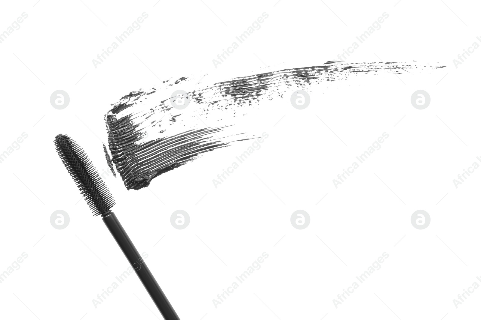 Photo of Smear of mascara and applicator isolated on white, top view