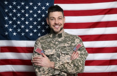 Photo of Portrait of happy cadet against American flag