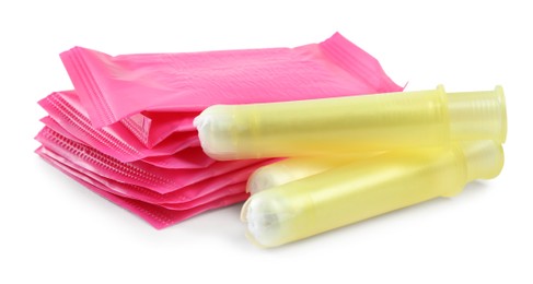 Photo of Pads and tampons on white background. Menstrual hygiene product