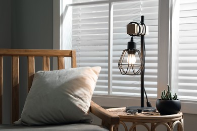 Photo of Room interior with stylish lamp and furniture