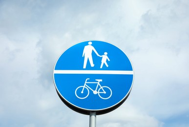 Traffic sign Compulsory Track For Pedestrians and Bicycles against blue sky