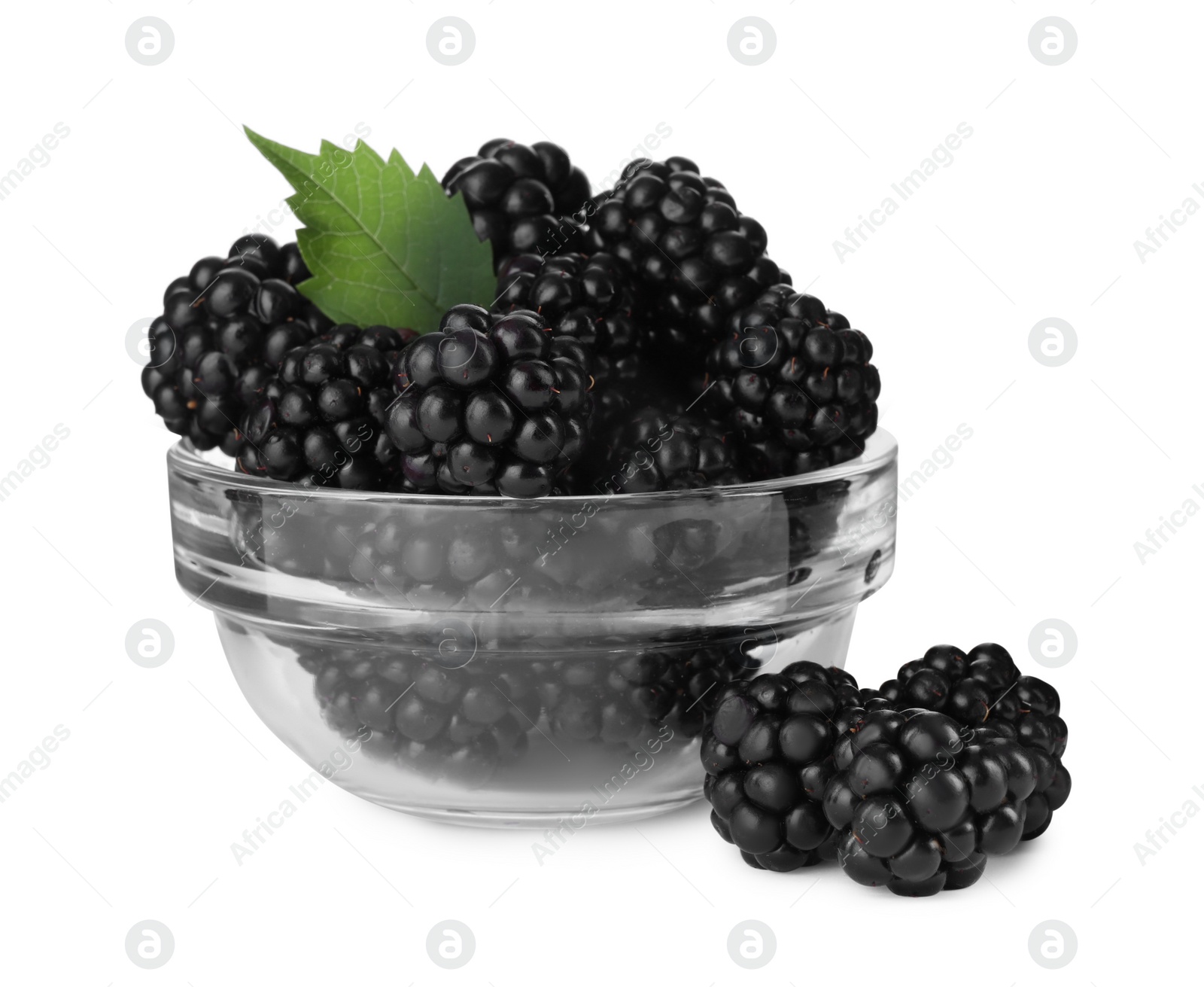 Photo of Fresh ripe blackberries in glass bowl isolated on white