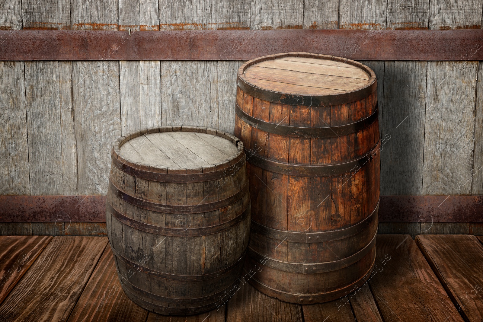 Image of Wooden barrels on brown surface near textured wall