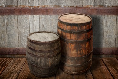 Image of Wooden barrels on brown surface near textured wall