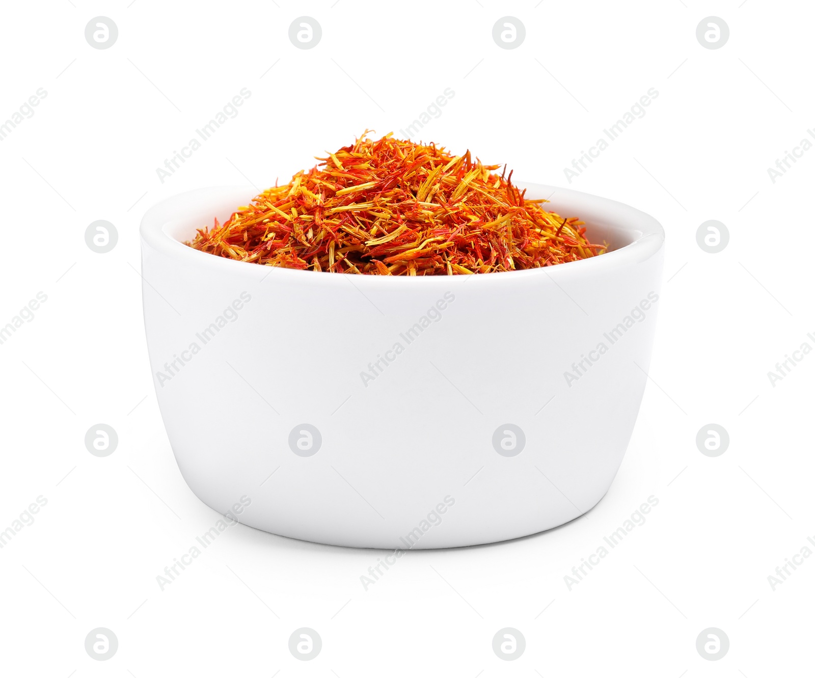 Photo of Aromatic saffron in bowl isolated on white