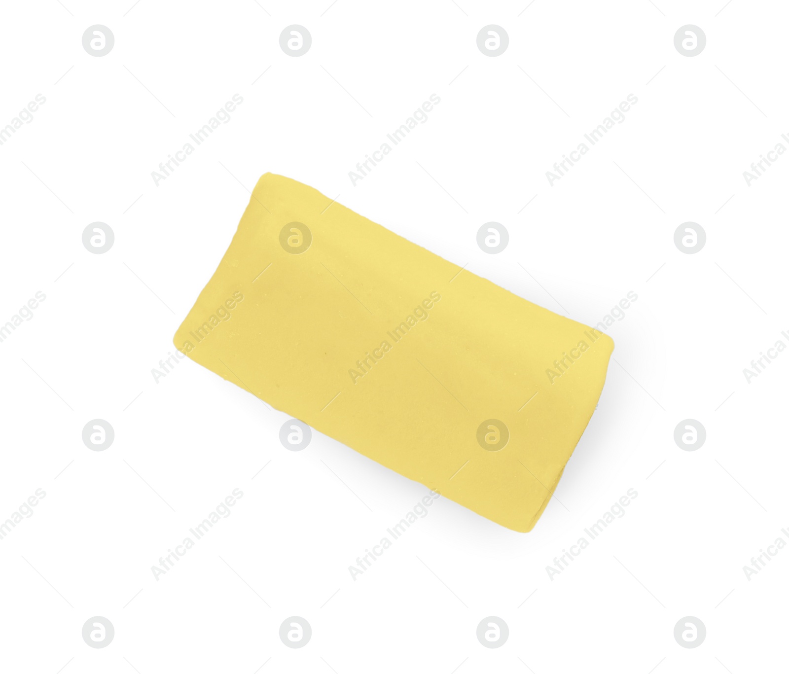 Photo of Yellow chewy candy with liquorice isolated on white, top view