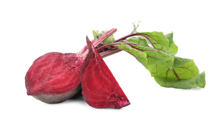 Photo of Cut fresh red beets with leaves on white background