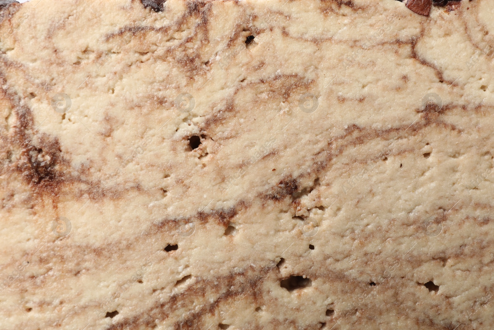 Photo of Tasty chocolate halva as background, closeup view