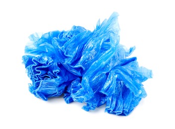 Photo of Pile of many blue medical shoe covers isolated on white
