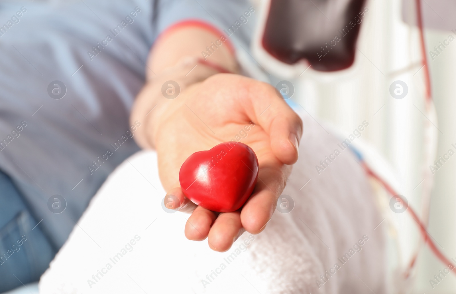 Photo of Man donating blood to save someone's life in hospital