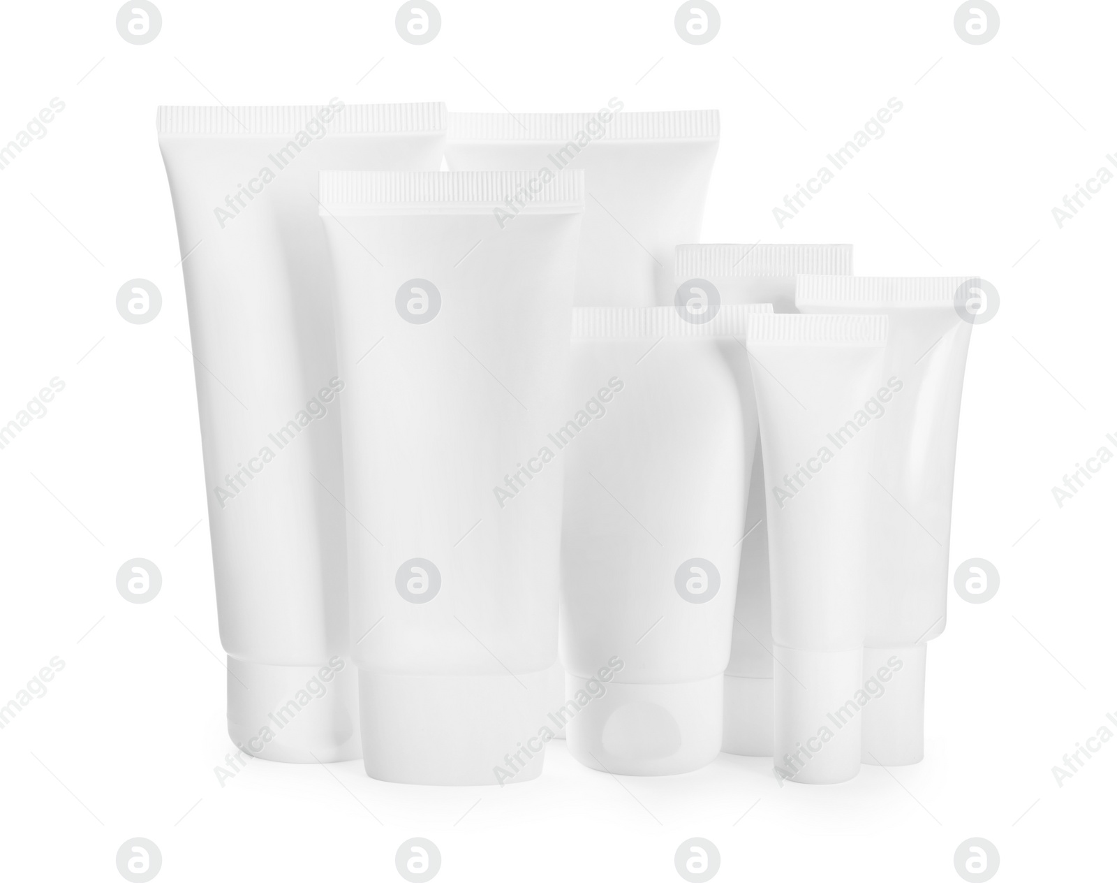 Photo of Blank tubes and jars of cosmetic products on white background