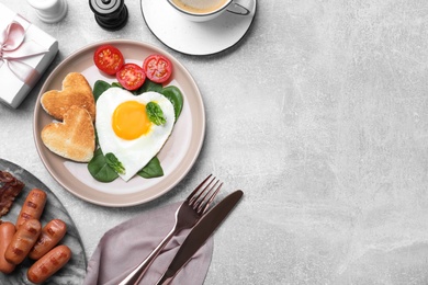 Photo of Romantic breakfast on light grey table, flat lay with space for text. Valentine's day celebration