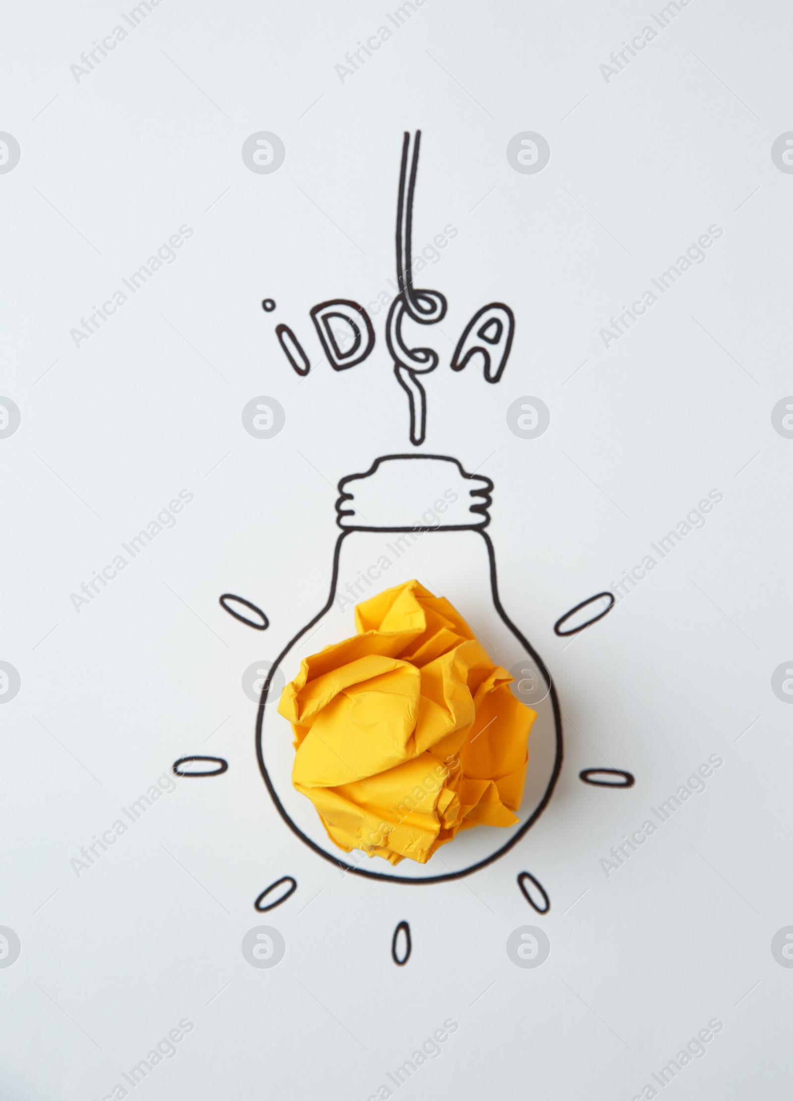 Photo of Drawn lamp bulb, crumpled paper and word IDEA on white background