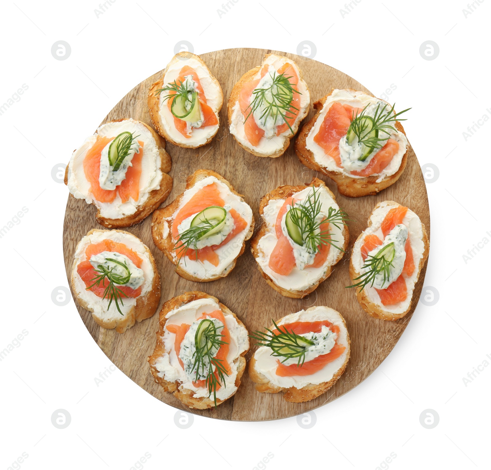 Photo of Tasty canapes with salmon, cucumber, cream cheese and dill isolated on white, top view