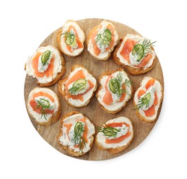 Photo of Tasty canapes with salmon, cucumber, cream cheese and dill isolated on white, top view