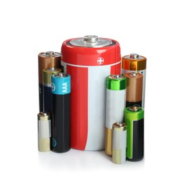 Image of Many batteries of different types on white background