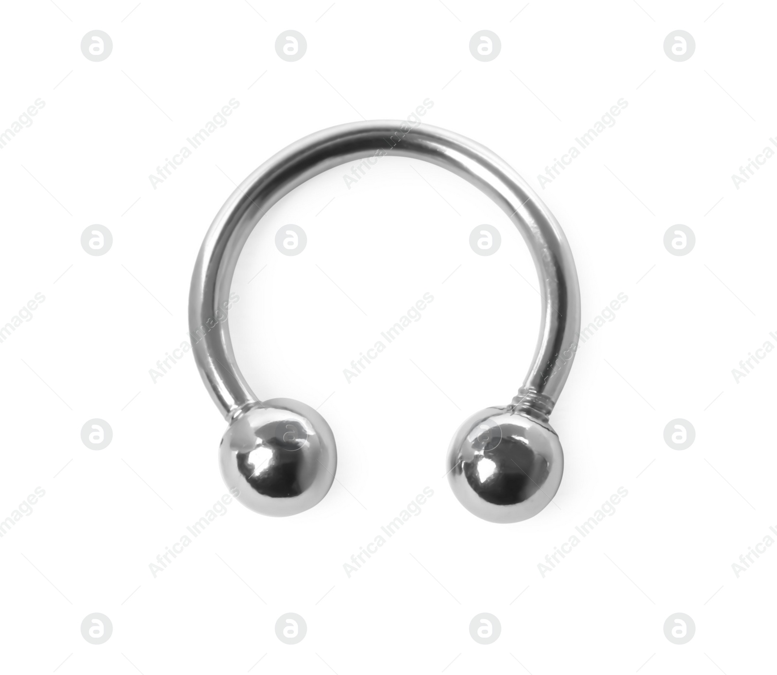 Photo of Piercing jewelry. Circular barbell isolated on white