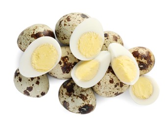 Unpeeled and peeled hard boiled quail eggs on white background, top view