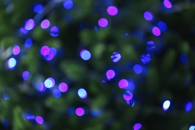 Abstract background with blurred violet Christmas lights, bokeh effect