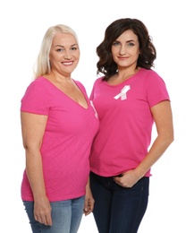 Photo of Women with silk ribbons on white background. Breast cancer awareness concept