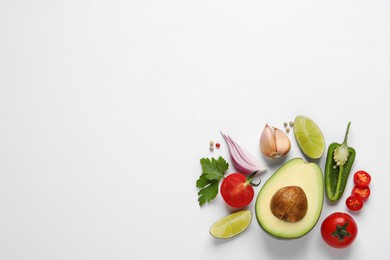 Photo of Fresh ingredients for guacamole on white background, flat lay