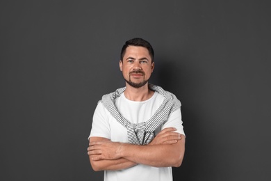 Portrait of handsome man on dark background