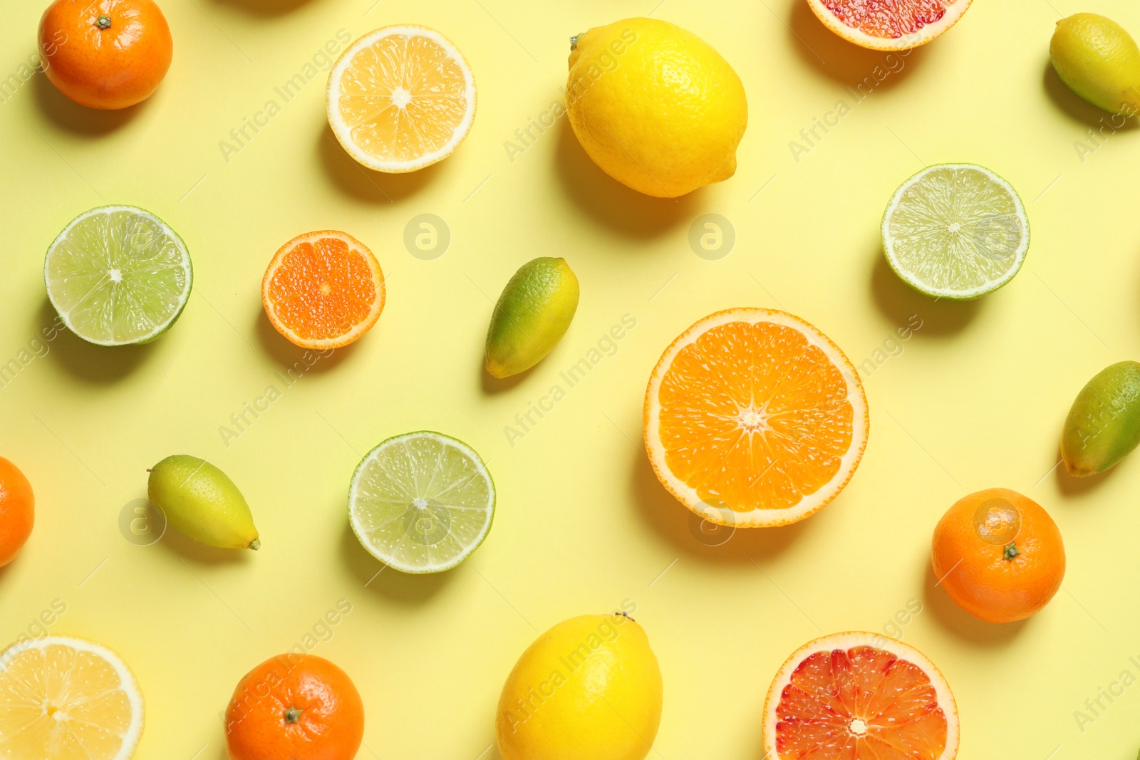 Photo of Different citrus fruits on color background, flat lay