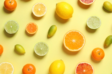 Photo of Different citrus fruits on color background, flat lay