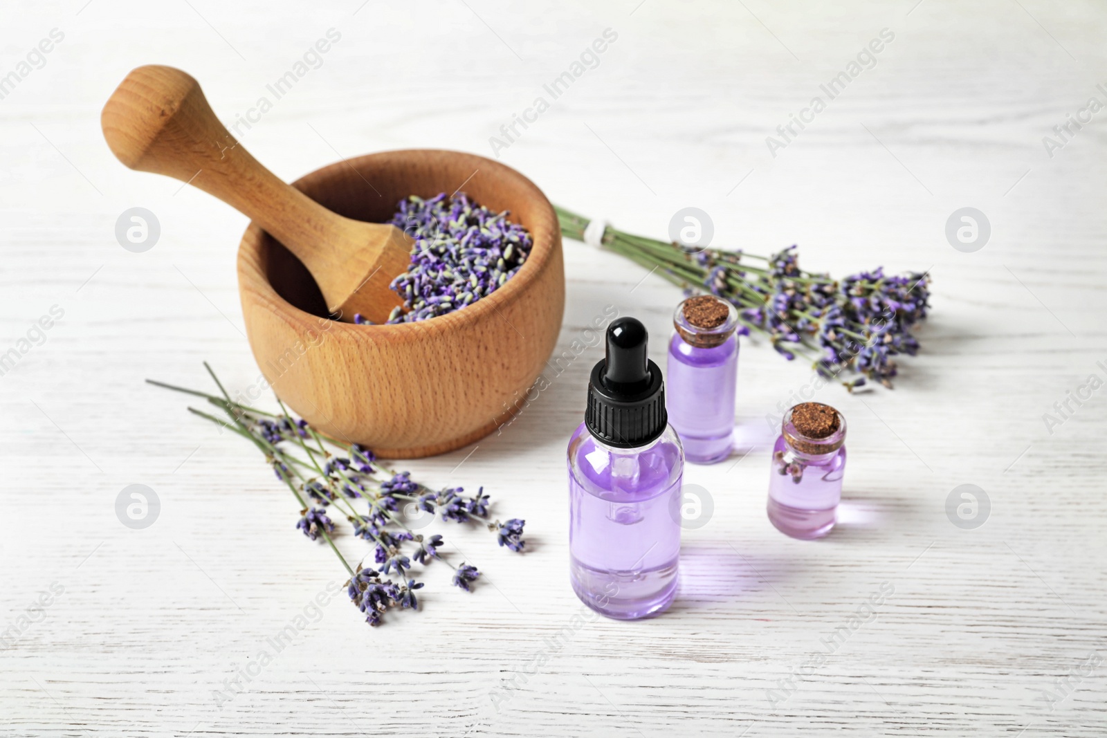 Photo of Composition with natural cosmetic products and lavender flowers on white wooden background