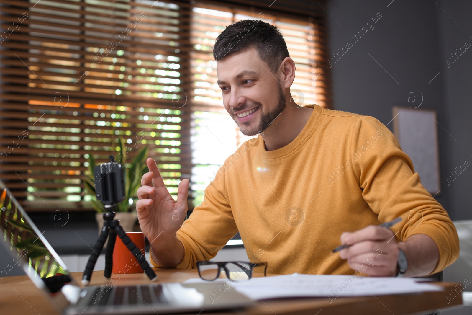 Photo of Teacher conducting online lesson at home during COVID-19 quarantine