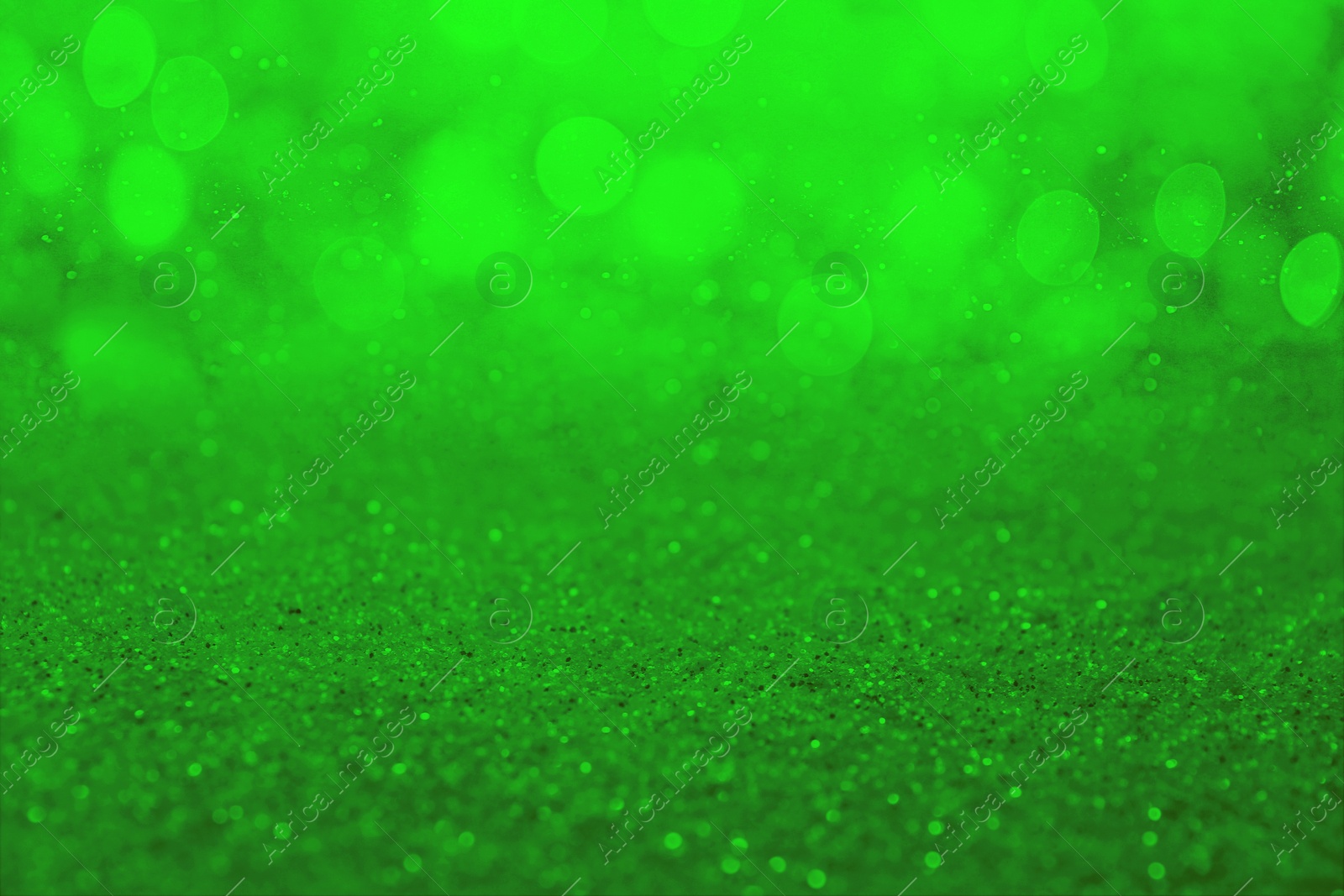 Image of St. Patrick day. Shiny green glitter, closeup. Bokeh effect