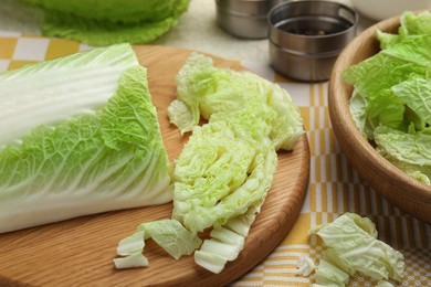 Cut fresh Chinese cabbage on table, closeup