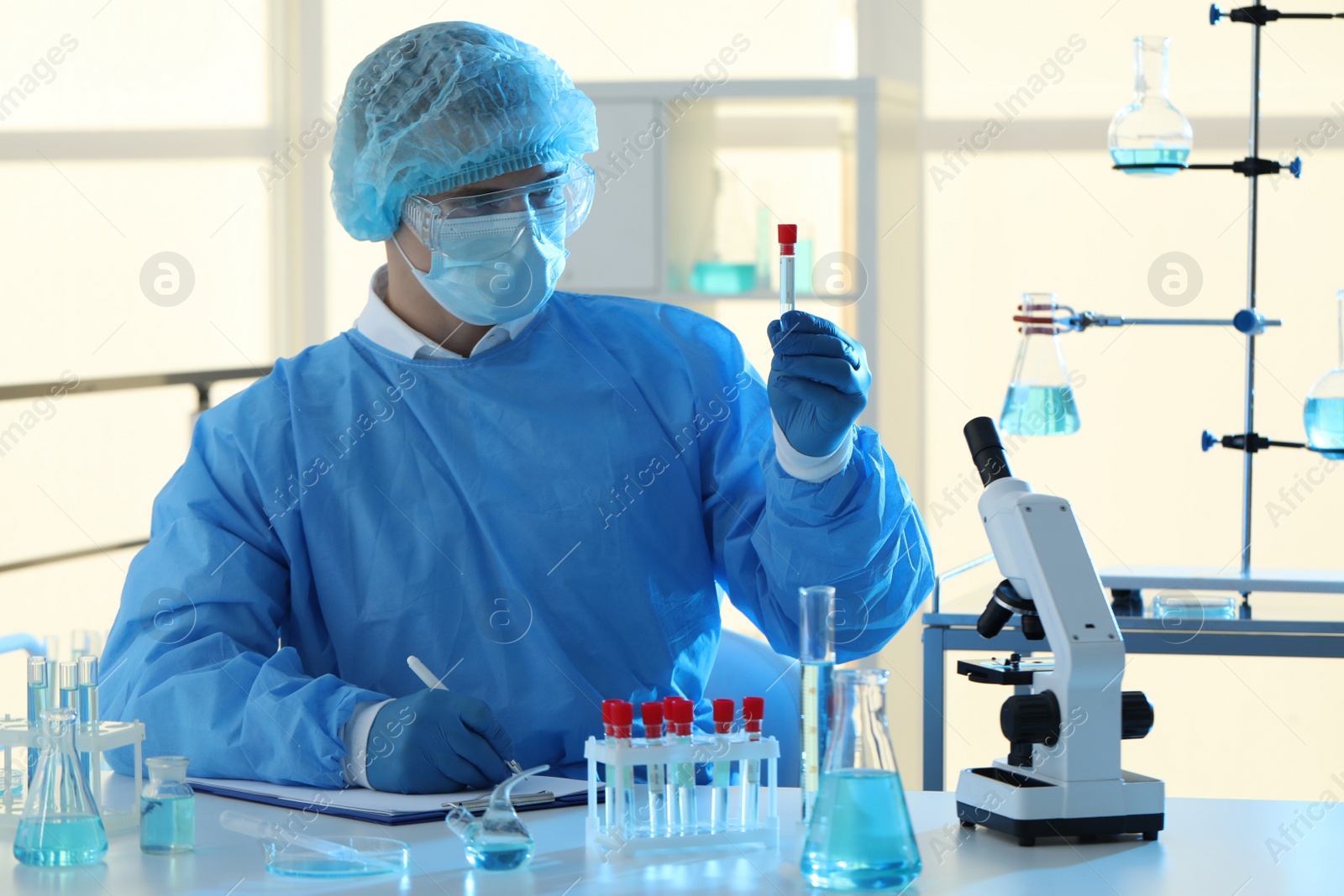 Photo of Scientist working with sample in laboratory. Medical research