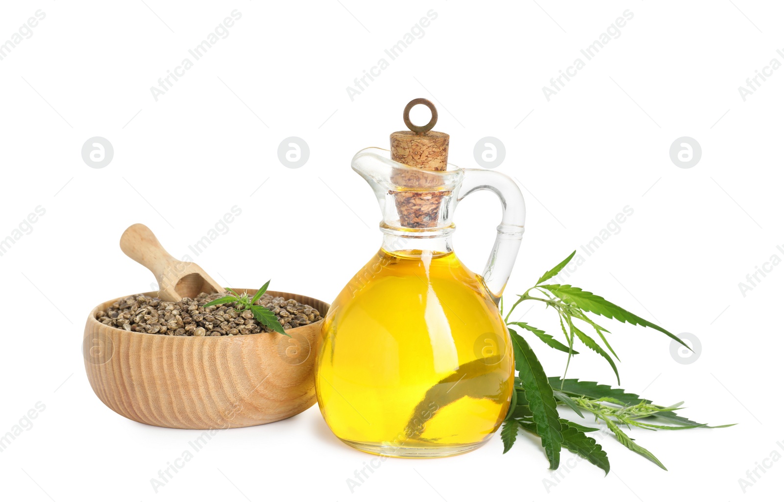 Photo of Hemp oil, fresh leaves and seeds on white background