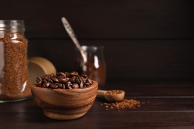 Photo of Different types of coffee on wooden table. Space for text