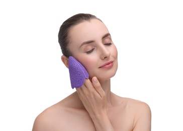 Photo of Young woman washing her face with sponge on white background