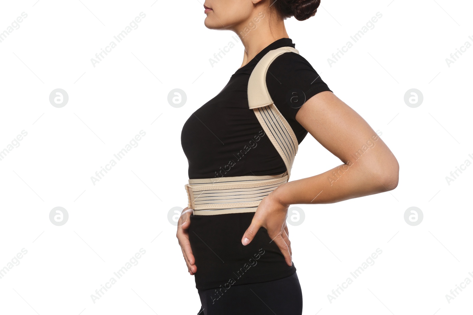 Photo of Closeup view of woman with orthopedic corset on white background