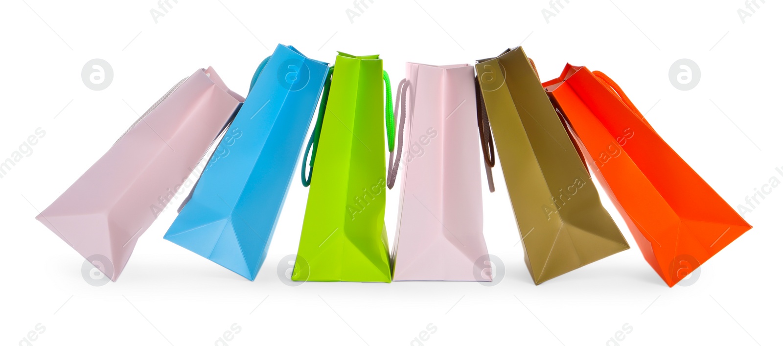 Photo of Colorful paper shopping bags isolated on white