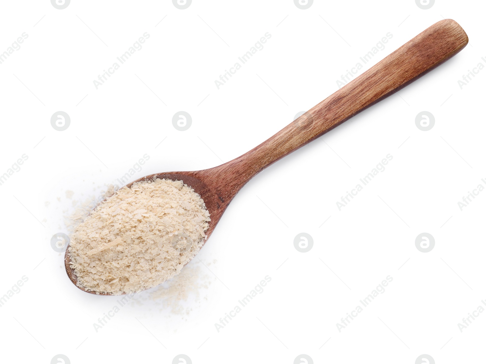 Photo of Brewer's yeast flakes in spoon isolated on white, top view