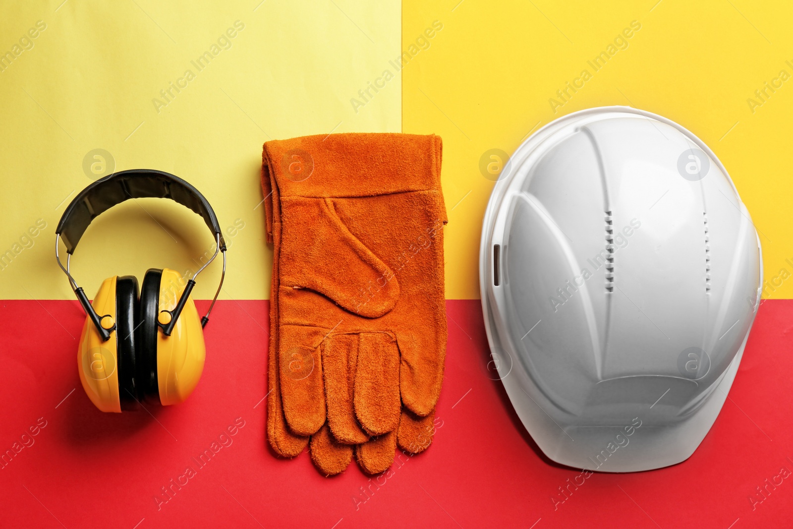 Photo of Flat lay composition with safety equipment on color background