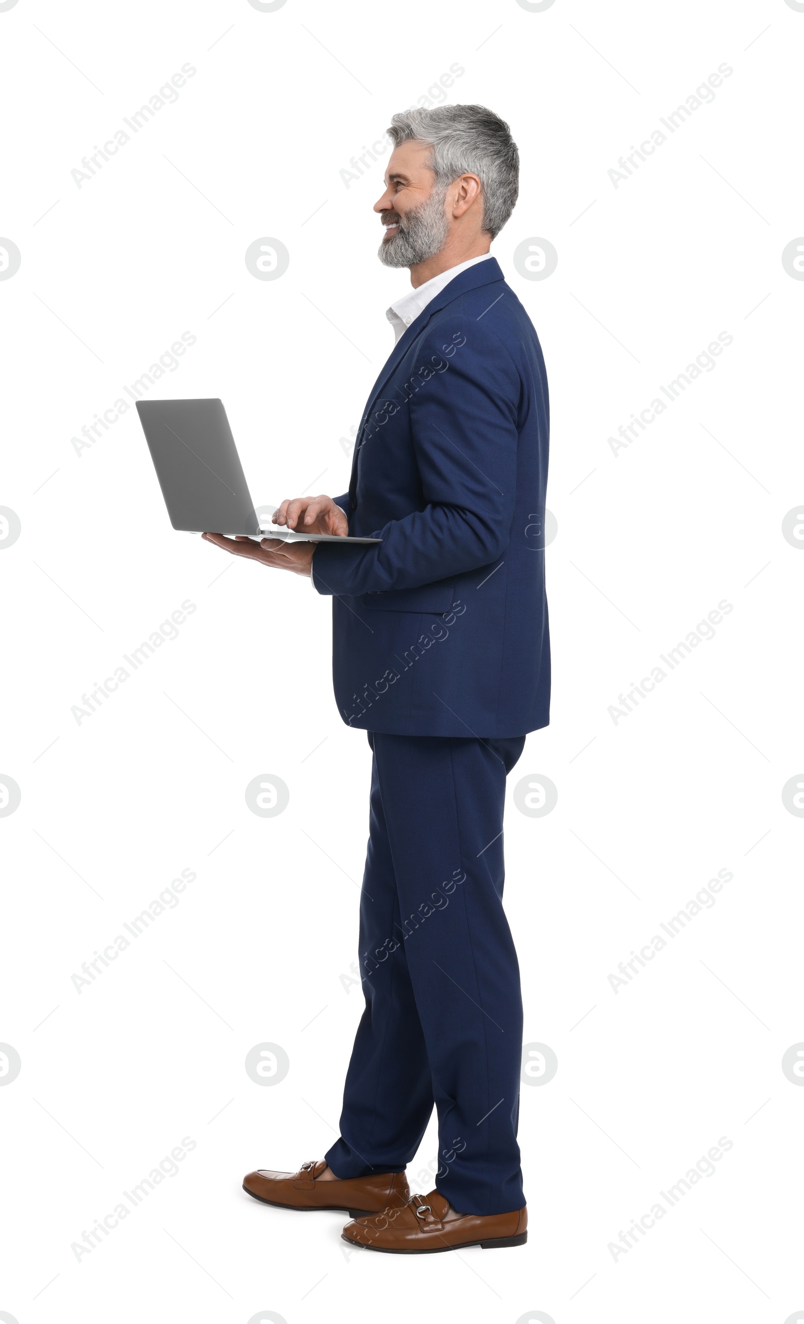 Photo of Mature businessman in stylish clothes with laptop on white background