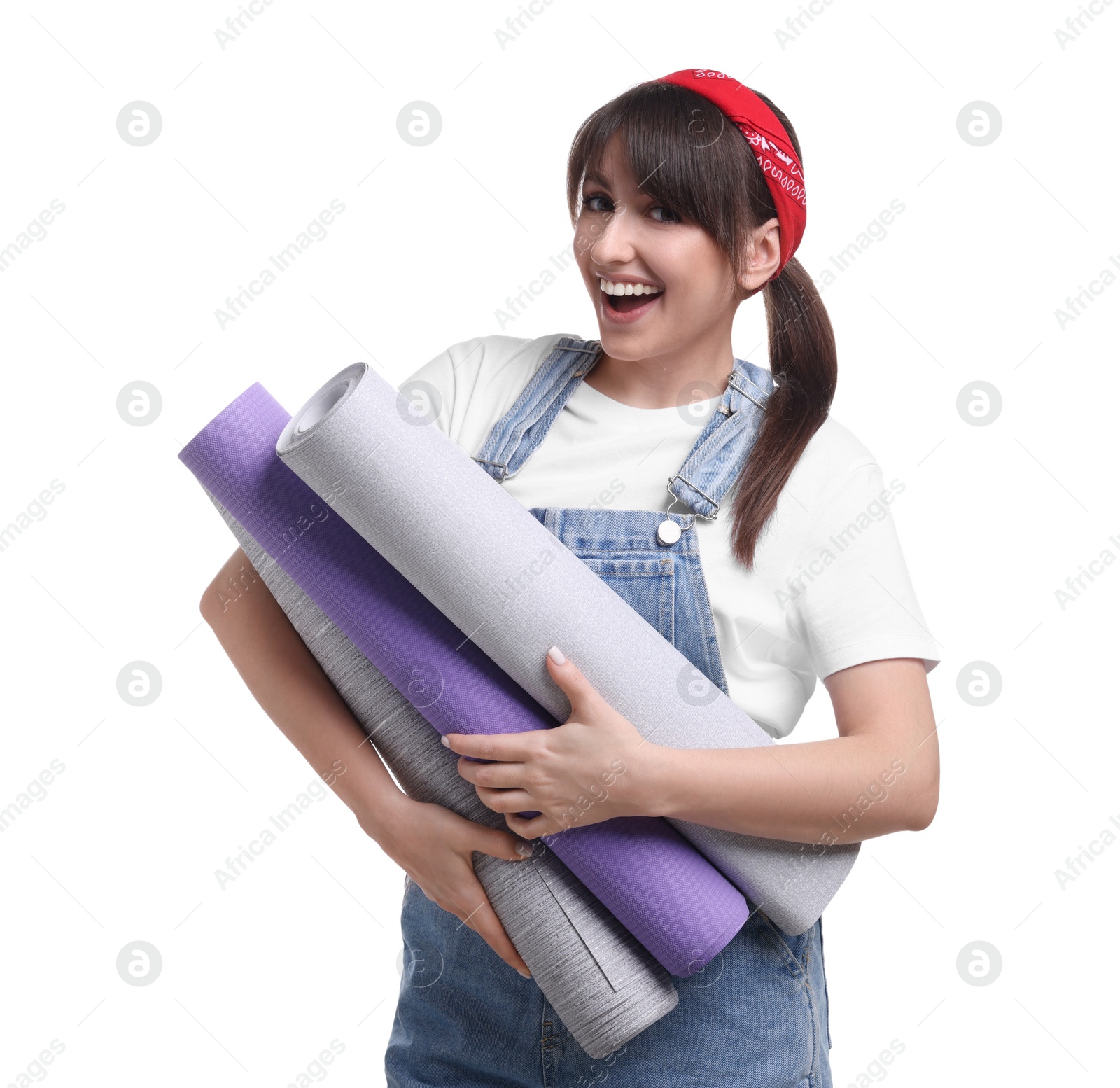 Photo of Beautiful woman with wallpaper rolls on white background