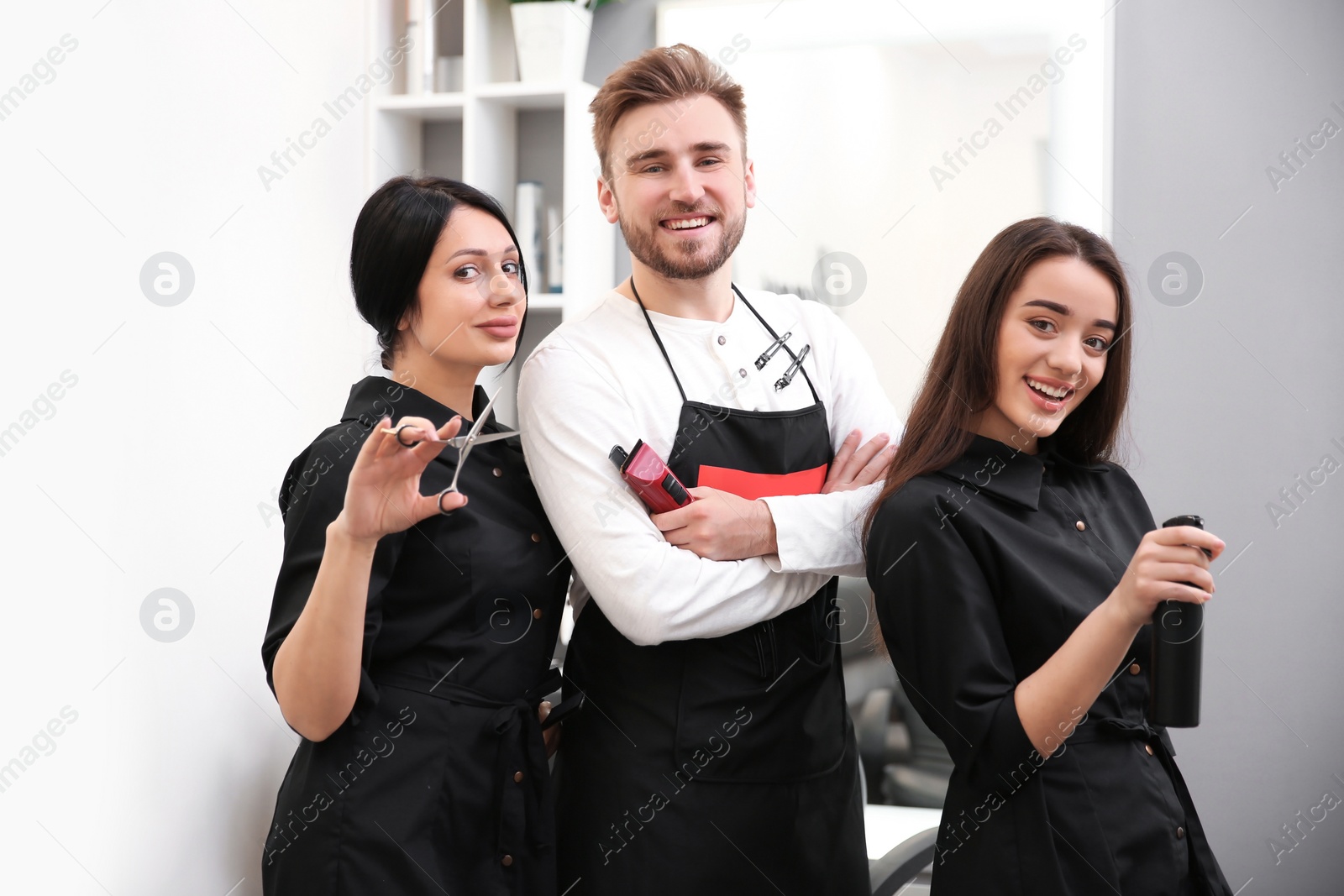 Photo of Professional hairdressers in salon