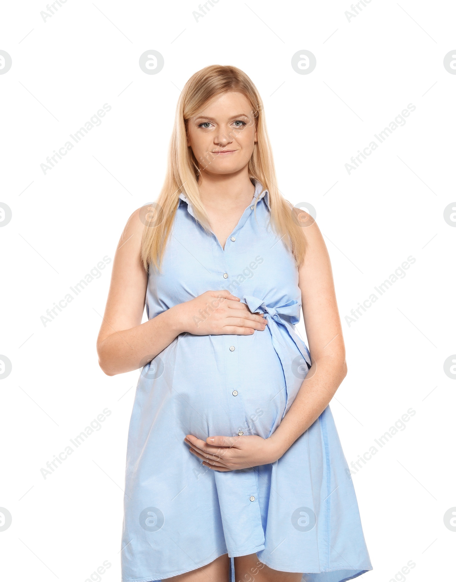 Photo of Beautiful pregnant woman in dress on white background