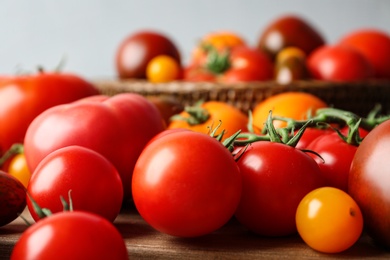 Photo of Many fresh ripe tomatoes on table, closeup