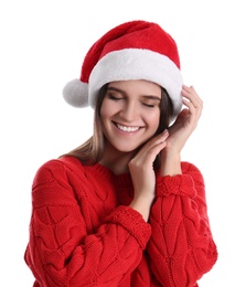 Pretty woman in Santa hat and red sweater on white background